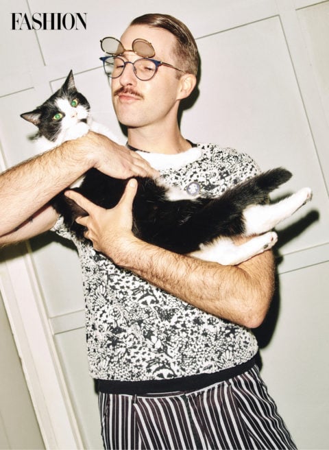 glasses collection: Grist poses with his cat