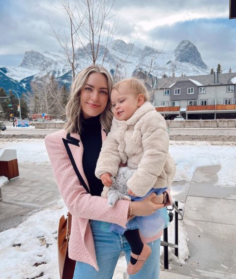 siera bearchell holds daughter lily against winter backdrop